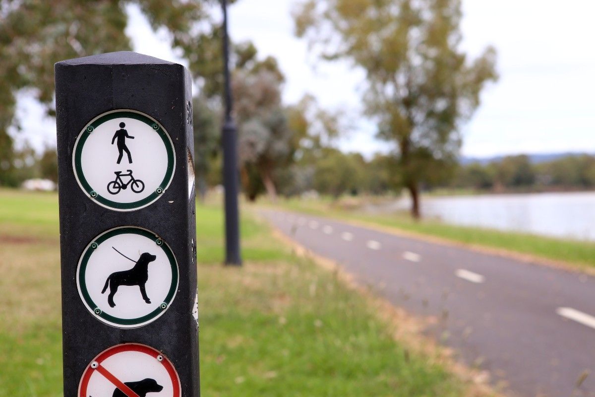 Signage on a post at shared park