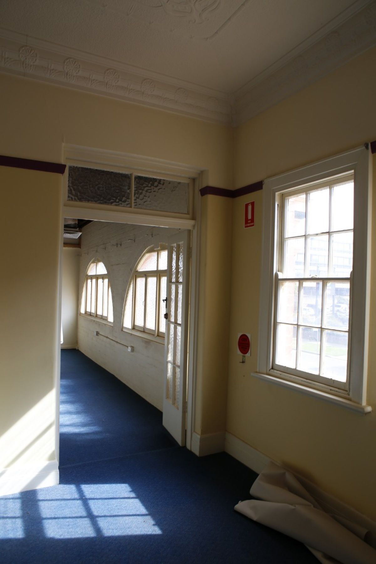 Sunshine coming in through old window on top floor of old ambulance station