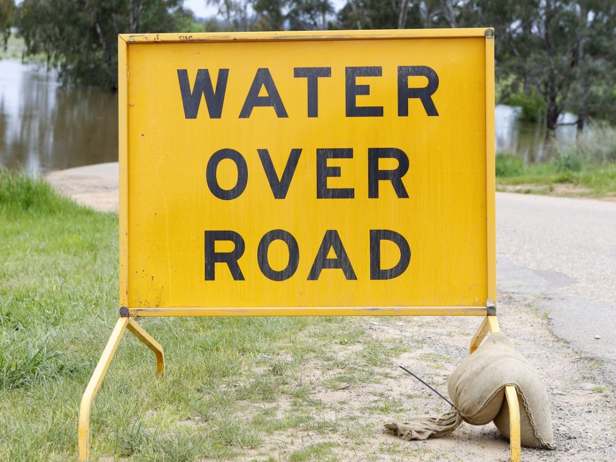 Water over road sign