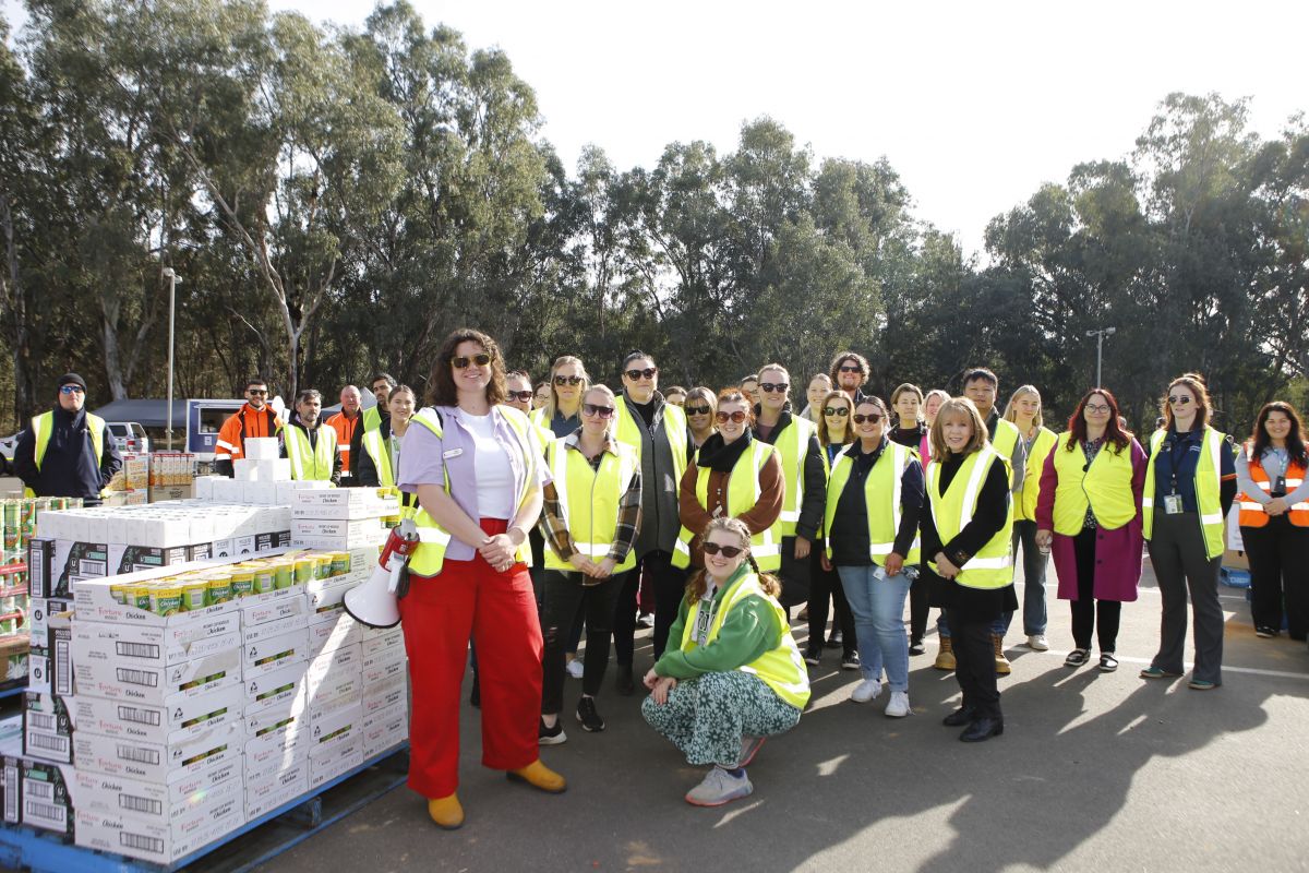 A group of people wearing high vision vests.